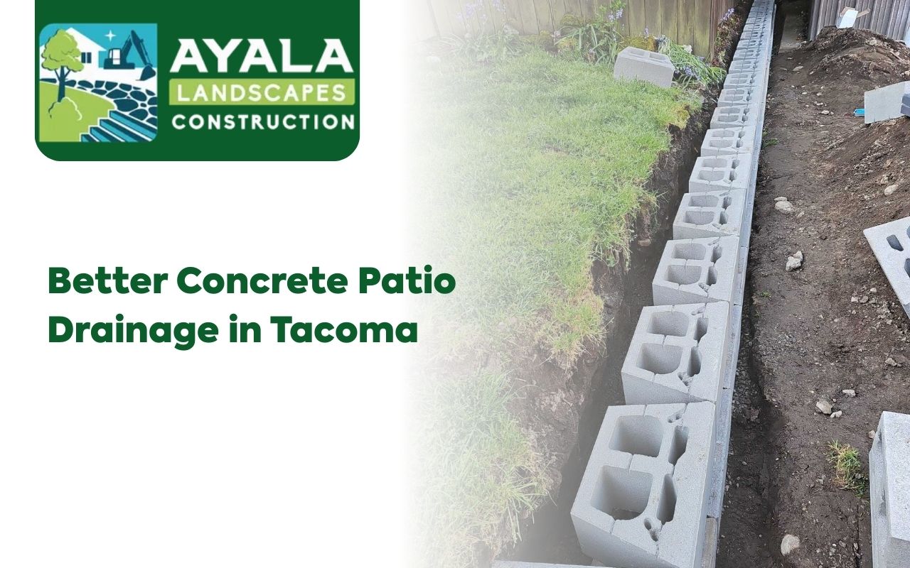 Channel drains installed on a concrete patio to improve Concrete Patio Drainage in Tacoma after heavy rain.